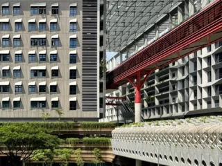 Image 10: Post #8 in our series featuring outstanding pictures of #punggoldigitaldistrict taken by talented WOHAcians for our company-wide photo competition. @kishinatsuki captured a great shot of the different layers and connections at PDD. Punggol Digital District (PDD) is a 50-hectare integrated district in Singapore designed to bring jobs, education, and social amenities closer to homes. It creates a highly liveable, vibrant, sustainable,and biophilic environment through innovative urban planning, balancing density with ample greenery, and fostering deep integration across its multiple strata. The direct synergy between the physically connected industry and academia creates an ecosystem for collaboration and one that spurs innovation. PDD’s strategic planning enables a significant portion of the site’s vegetation to be conserved and transformed into a Community Park, thereby preserving a precious and generous green breathing space at the heart of the district. Design Inception: 2017 Client: @jtc_sg #punggoldigitaldistrict #masterplan #futurecity #urbanplanning #greencity #singapore #singaporearchitecture #businesspark #mixeduse #regenerative #design #education #educationalarchitecture #campus #boulevard #carlite #pedestrianfriendly #pedestrianbridge #bridge #jtcsg #singaporetech #singaporeinstituteoftechnology #woha