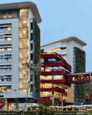 Image 7: Post #10 in our series featuring outstanding pictures of #punggoldigitaldistrict taken by talented WOHAcians for our company-wide photo competition. This lovely shot of a bridge connecting to the library block of @singaporetech, which is a part of the larger Punggol Digital District Masterplan, was taken by @kishinatsuki. It is the academic heart of the campus and is wrapped in red fins - the connecting bridges branch out from it to the rest of the district like arteries. Punggol Digital District (PDD) is a 50-hectare integrated district in Singapore designed to bring jobs, education, and social amenities closer to homes. It creates a highly liveable, vibrant, sustainable,and biophilic environment through innovative urban planning, balancing density with ample greenery, and fostering deep integration across its multiple strata. The direct synergy between the physically connected industry and academia creates an ecosystem for collaboration and one that spurs innovation. PDD’s strategic planning enables a significant portion of the site’s vegetation to be conserved and transformed into a Community Park, thereby preserving a precious and generous green breathing space at the heart of the district. Design Inception: 2017 Client: @jtc_sg #punggoldigitaldistrict #masterplan #futurecity #urbanplanning #greencity #singapore #singaporearchitecture #businesspark #mixeduse #regenerative #design #education #educationalarchitecture #campus #boulevard #carlite #pedestrianfriendly #pedestrianbridge #bridge #jtcsg #singaporetech #singaporeinstituteoftechnology #woha